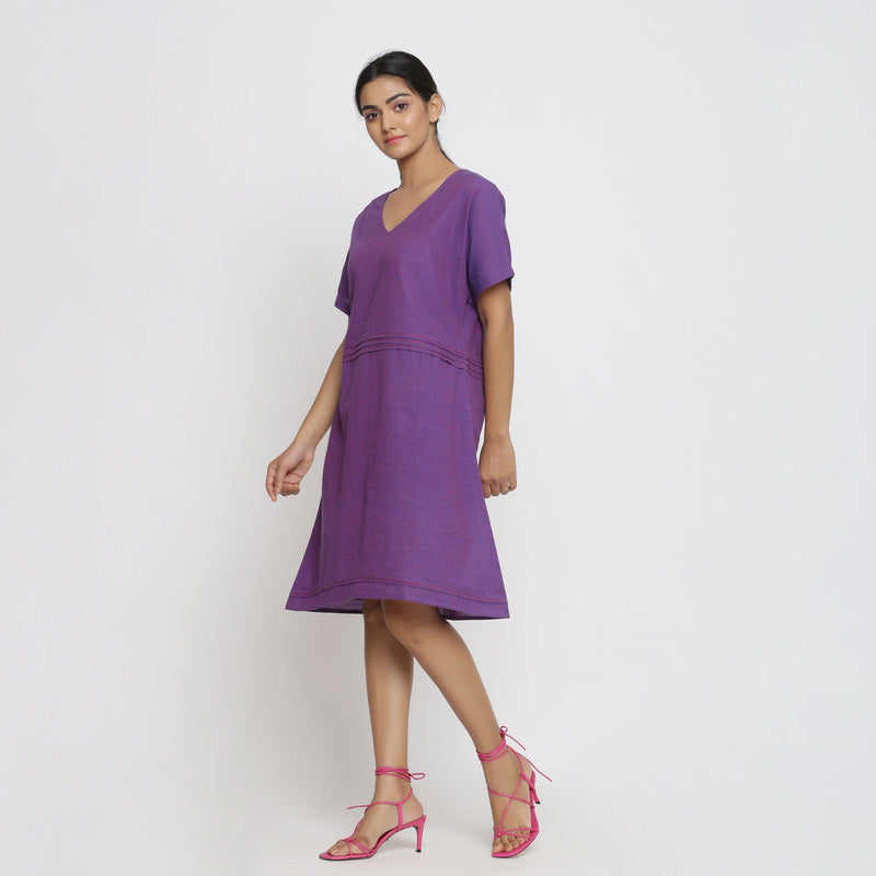 Left View of a Model wearing Violet Cotton V-Neck Pleated Dress