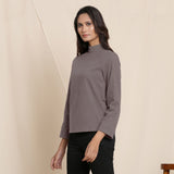 Left View of a Model wearing Warm Ash Grey Turtleneck Straight Top