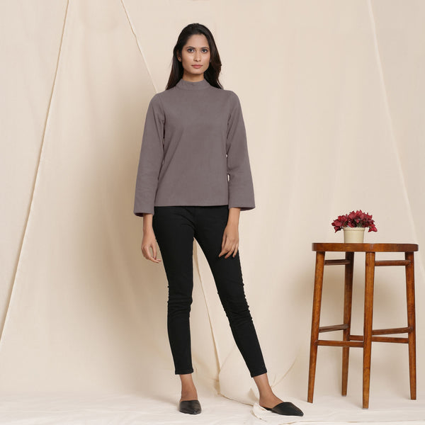 Front View of a Model wearing Warm Ash Grey Turtleneck Straight Top