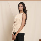 Left View of a Model wearing Warm Beige A-Line Cotton Top