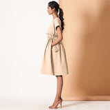 Left View of a Model wearing Beige Warm Cotton Flannel Knee Length Frilled Dress