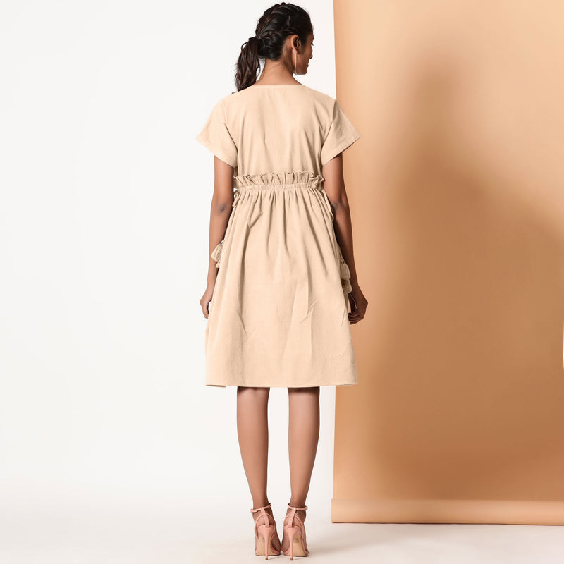 Back View of a Model wearing Beige Warm Cotton Flannel Knee Length Frilled Dress