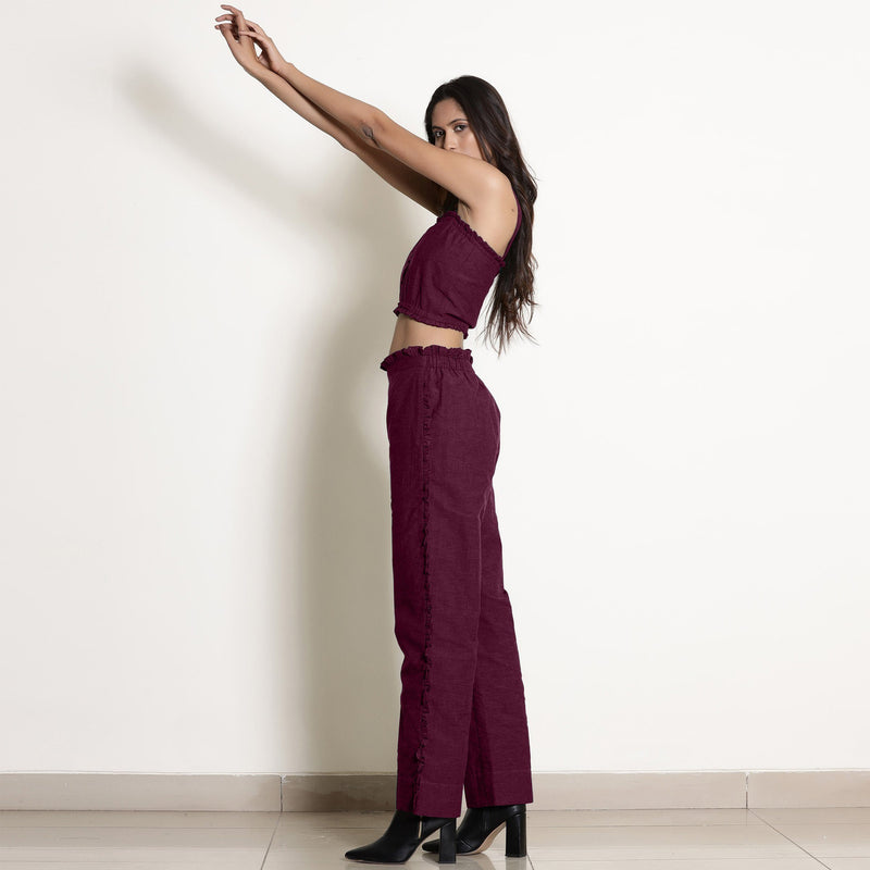 Left View of a Model wearing Warm Berry Wine Frilled Straight Pant