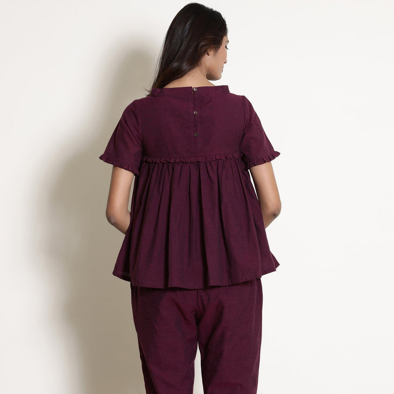 Back View of a Model wearing Warm Berry Wine Gathered Frilled Top