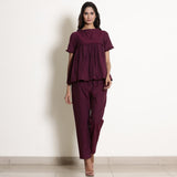 Front View of a Model wearing Warm Berry Wine Frilled Top and Pant Set