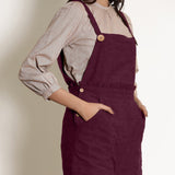 Front Detail of a Model wearing Warm Berry Wine Frilled Waist Romper