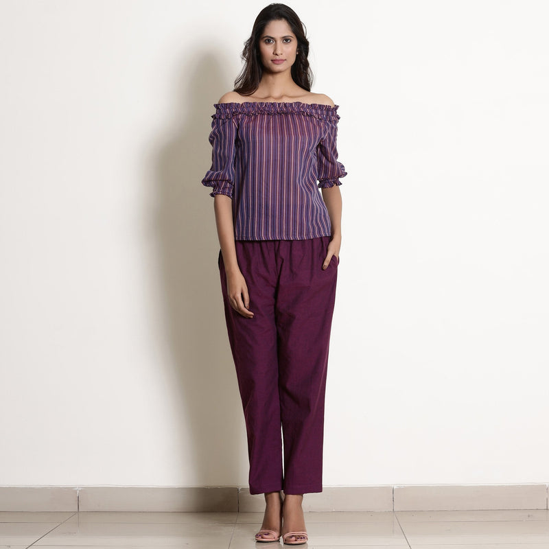 Front View of a Model wearing Solid Berry Wine Warm Cotton Tapered Pant