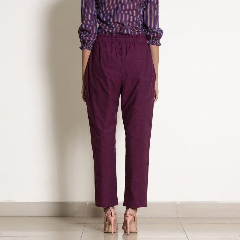 Back View of a Model wearing Solid Berry Wine Warm Cotton Tapered Pant