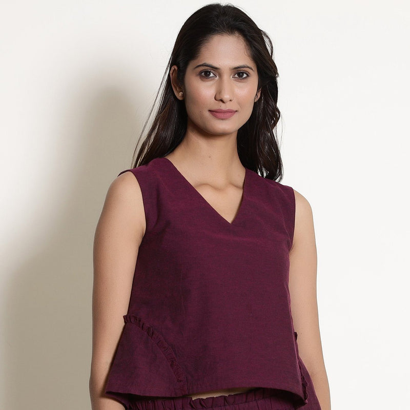 Front View of a Model wearing Warm Berry Wine V-Neck Flared Top