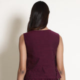 Back View of a Model wearing Warm Berry Wine V-Neck Flared Top