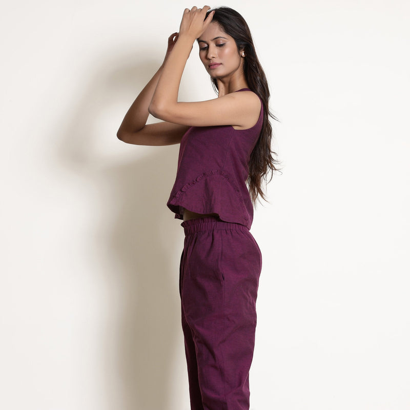 Left View of a Model wearing Berry Wine Warm Cotton Sleeveless Frilled Godet Top