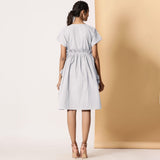 Back View of a Model wearing Cloudy Grey Warm Cotton Flannel Knee Length Frilled Dress