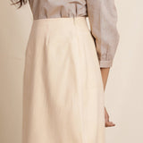 Left Detail of a Model wearing Warm Flannel Dusk Beige Pencil Skirt
