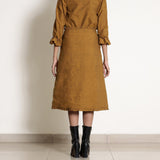 Back View of a Model wearing Golden Oak Warm Cotton Frilled Midi Skirt