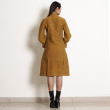 Back View of a Model wearing Golden Oak Warm Cotton Frilled Knee Length Dress