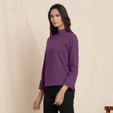 Left View of a Model wearing Warm Grape Wine Turtleneck Straight Top