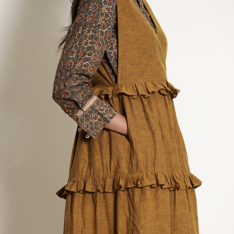 Right Detail of a Model wearing Warm Kalamkari Shirt and Tier Pinafore Dress Set