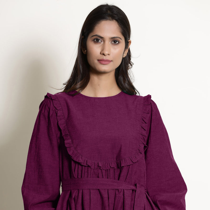 Front Detail of a Model wearing Warm Mulberry 100% Cotton Frilled Yoke Dress