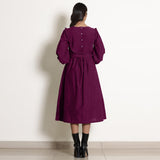 Back View of a Model wearing Warm Mulberry 100% Cotton Frilled Yoke Dress