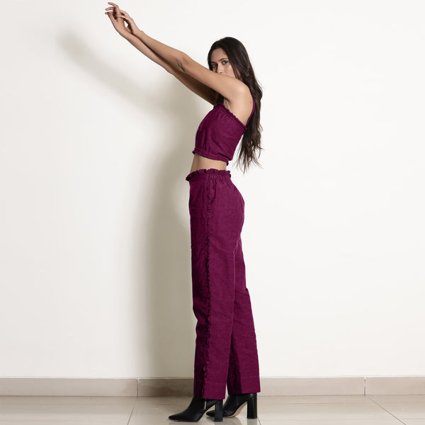 Left View of a Model wearing Warm Mulberry Frilled Straight Pant
