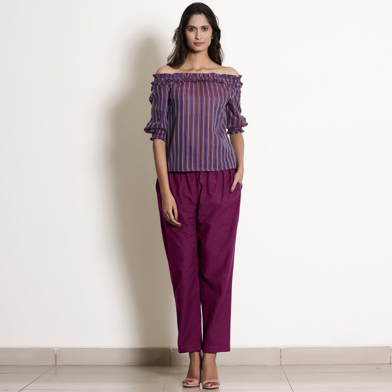 Front View of a Model wearing Warm Mulberry Frilled Waist Tapered Cotton Pant
