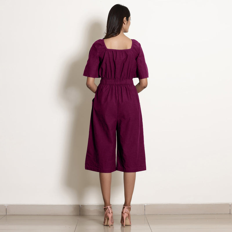 Back View of a Model wearing Warm Mulberry Loose Fit Cotton Jumpsuit