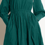 Front Detail of a Model wearing Warm Pine Green Fit and Flare Dress