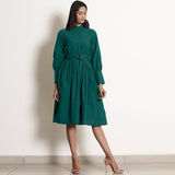 Front View of a Model wearing Warm Pine Green Fit and Flare Dress