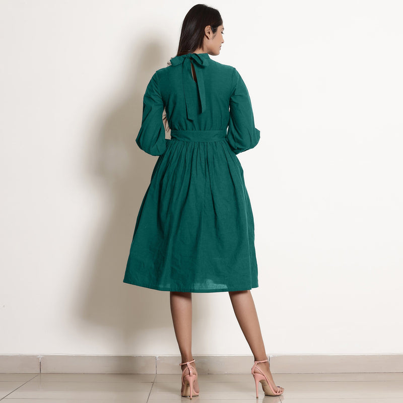 Back View of a Model wearing Warm Pine Green Fit and Flare Dress