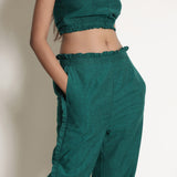 Front Detail of a Model wearing Pine Green Frill Warm Cotton Mid-Rise Paperbag Pant