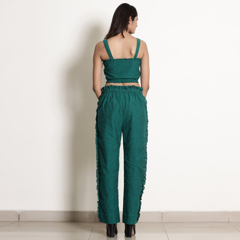 Back View of a Model wearing Pine Green Frill Warm Cotton Mid-Rise Paperbag Pant