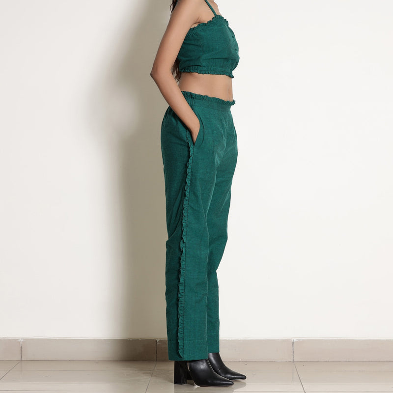 Right View of a Model wearing Pine Green Frill Warm Cotton Mid-Rise Paperbag Pant