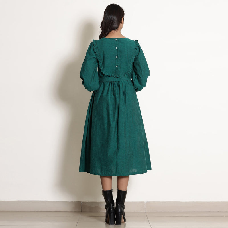 Back View of a Model wearing Pine Green Warm Cotton Frilled Midi Yoke Dress