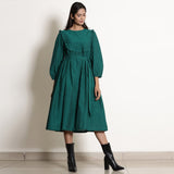 Front View of a Model wearing Pine Green Warm Cotton Frilled Midi Yoke Dress