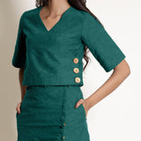 Front Detail of a Model wearing Warm Pine Green V-Neck Wrap Top