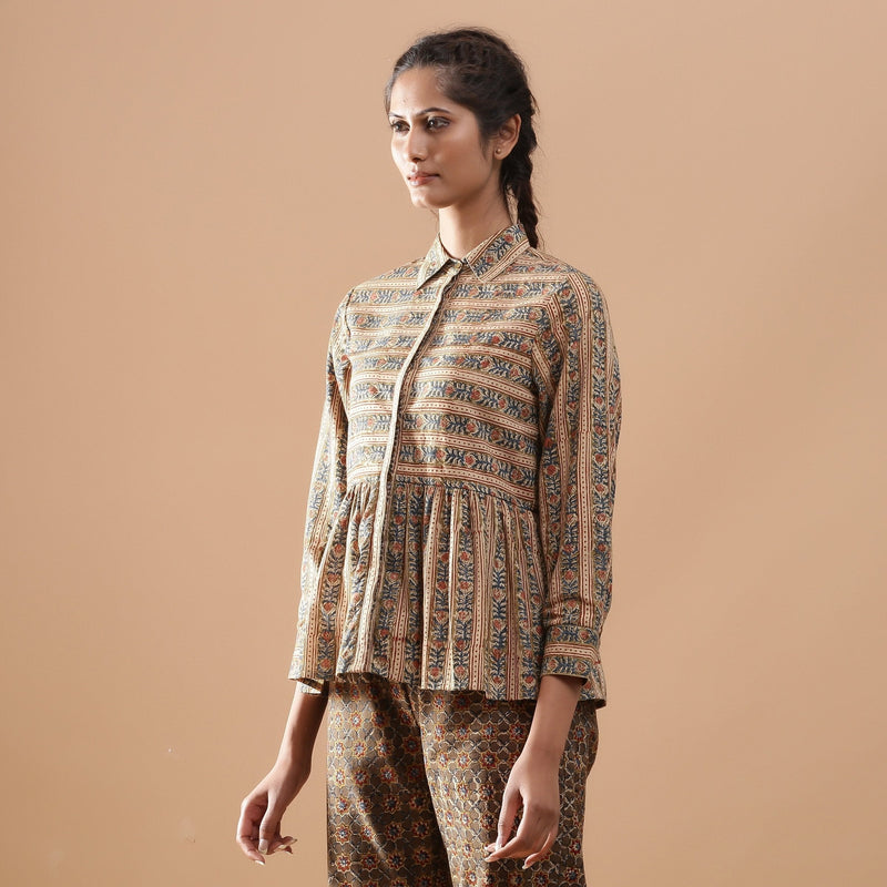 Left View of a Model wearing Beige Floral Warm Block Print Cotton Shirt
