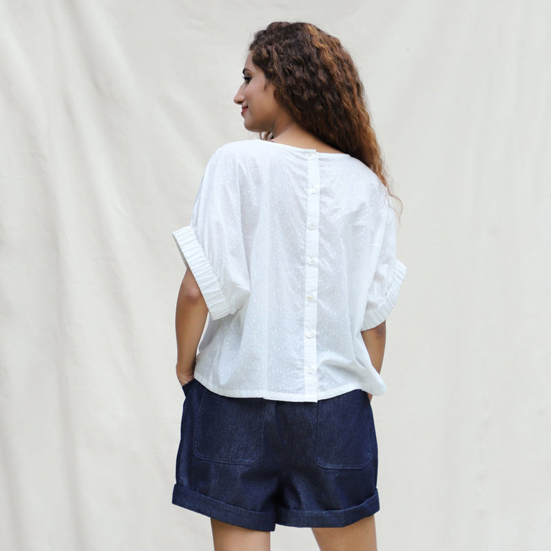 Back View of a Model wearing White 100% Cotton Hand-Beaded Drop Shoulder Button-Down Shirt