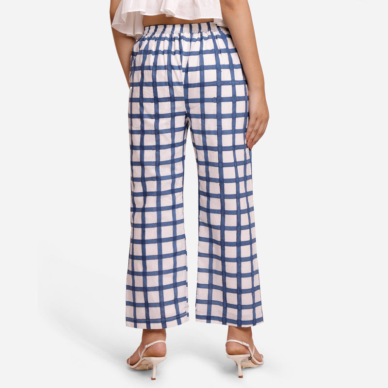 Back View of a Model wearing White and Blue Checks Block Print Ankle Length Cotton Pant
