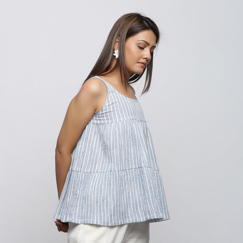 Right View of a Model wearing White and Blue Yarn Dyed Flared Top