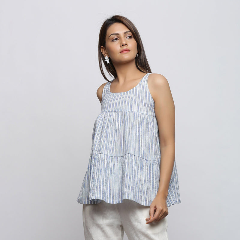 Front View of a Model wearing White and Blue Yarn Dyed Flared Top