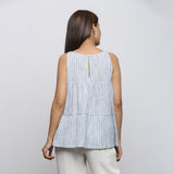 Back View of a Model wearing White and Blue Yarn Dyed Flared Top