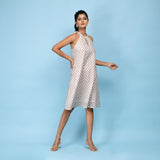 Right View of a Model wearing White Block Printed Cotton Knee Length Dress