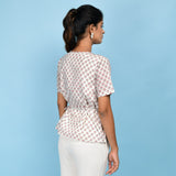Back View of a Model wearing White Floral Block Printed Cotton A-Line Top
