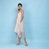 Left View of a Model wearing White Block Printed High-Low Cotton Midi Dress