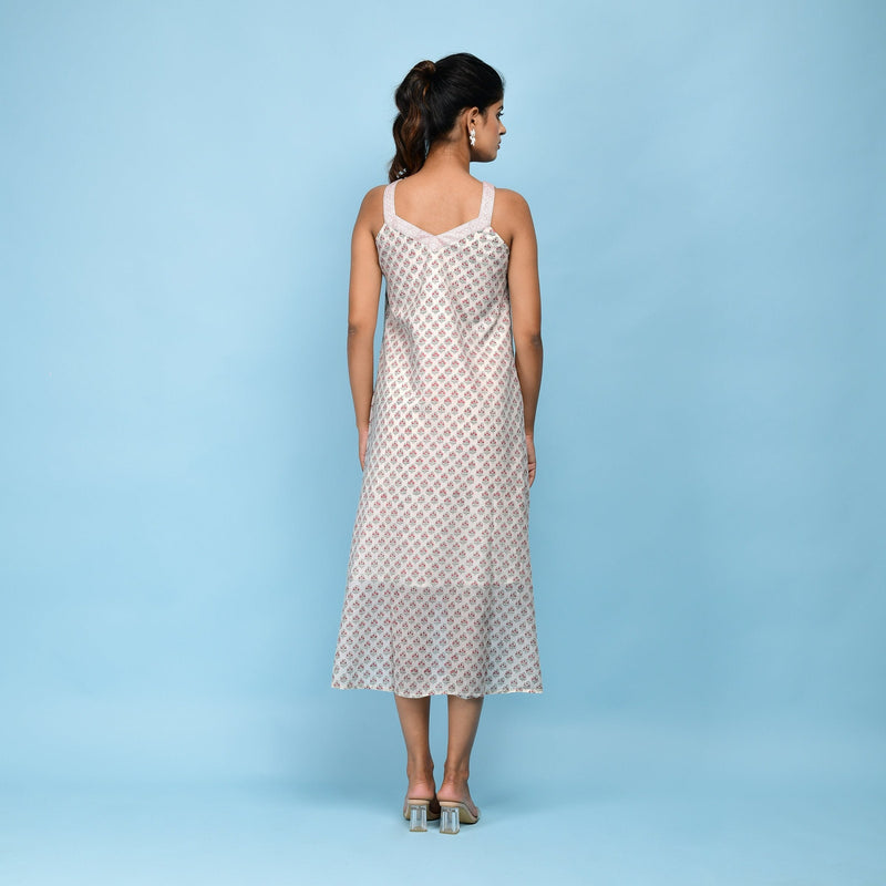 Back View of a Model wearing White Block Printed High-Low Cotton Midi Dress