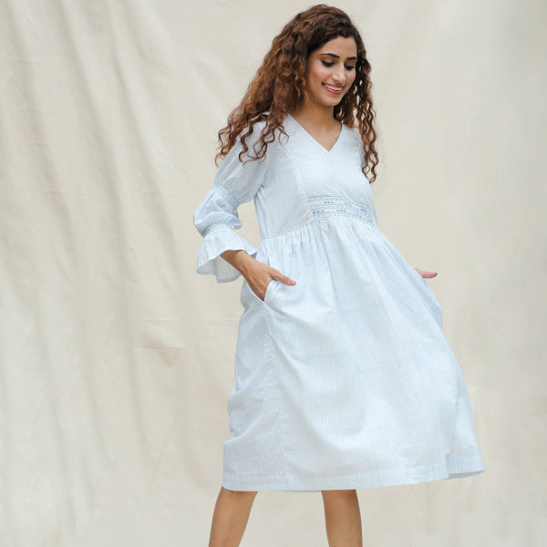 Right View of a Model wearing White and Blue Block Printed Cotton Striped Bohemian Midi Dress