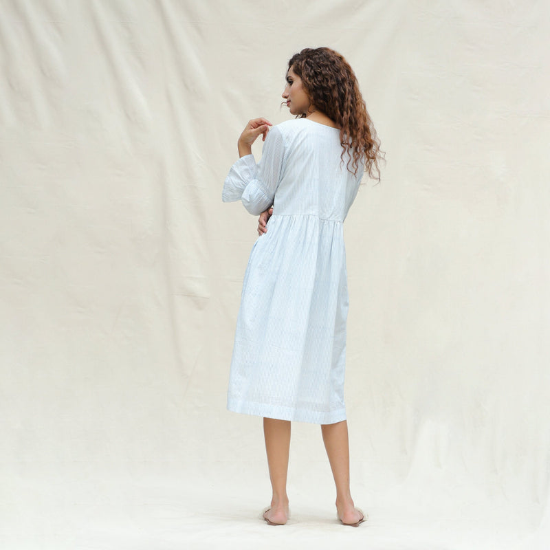 Back View of a Model wearing White and Blue Block Printed Cotton Striped Bohemian Midi Dress