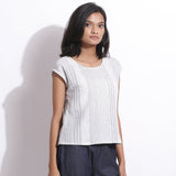 Right View of a Model wearing White Blue Striped Cotton Straight Top