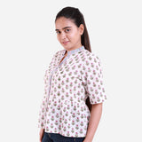 Left View of a Model wearing White Block Print Cotton Lace Mandarin Collar Top