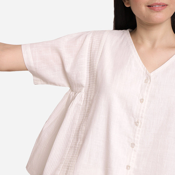 Front Detail of a Model wearing White Button-Down Paneled Cotton Top